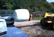 Video-0012.mp4 unloading bales in the summer 2009