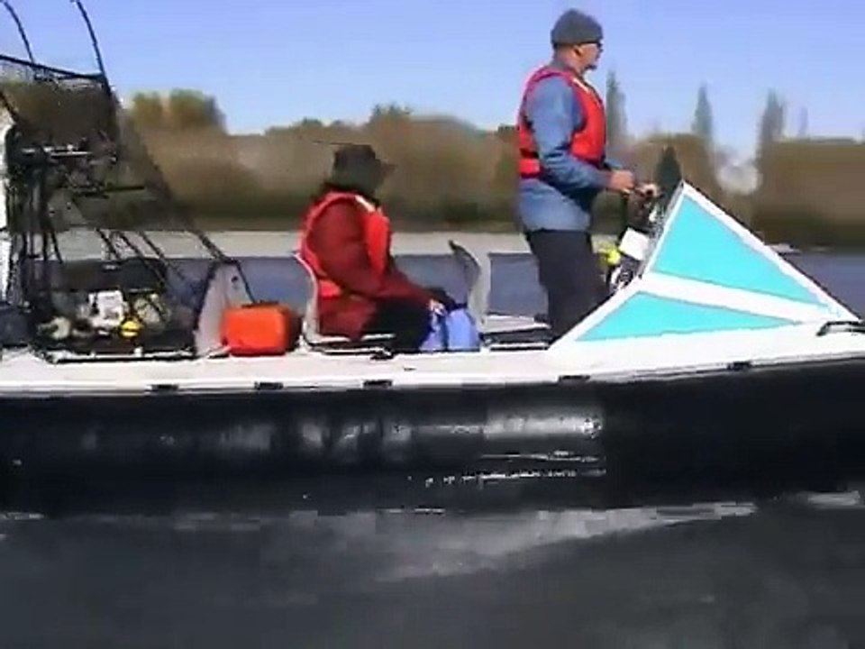 Hovercraft  on a stony river against the flow