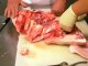 Cleaning a Pig's head for head cheese.
