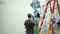 Graffiti artist David Choe painting facebook's office.