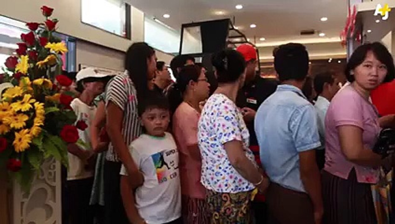 KFC has opened in Myanmar and customers are waiting in lines for hours to get the Colonel's fried chicken.
