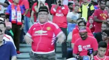 Dancing Manchester United fan sits in Liverpool crowd and absolutely LOVES it