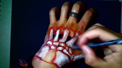 Artist creates realistic 3D skeleton illusion in his hand