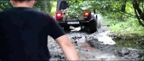 TJ Jeep Wrangler on COOPER Discoverer STT tires in mud