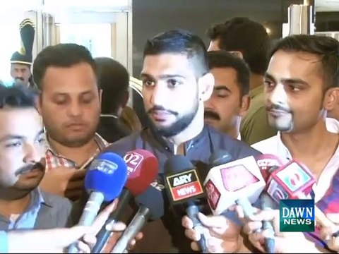 Pakistani boxer Amir Khan talking with media on Lahore Airport