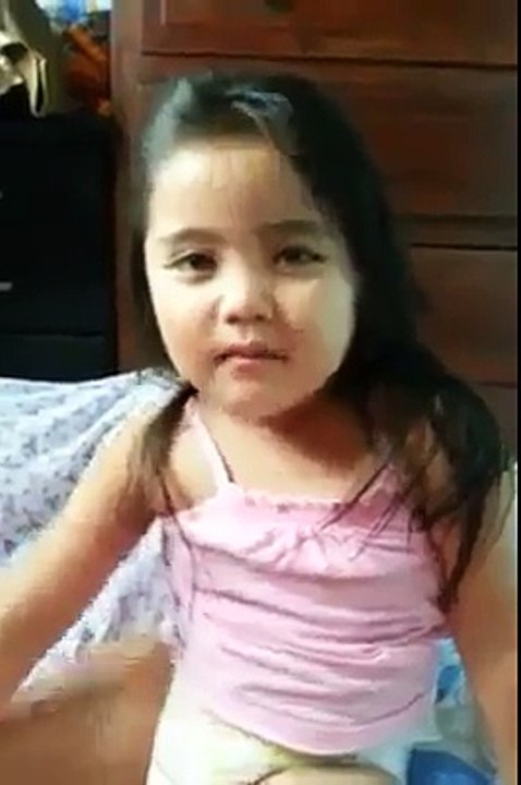 little cute girl reciting Quran