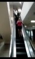 Stupid girl doesn't realize she's going up the wrong way on the escalator