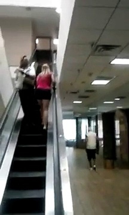 Woman High on Drugs Try to Go Up and Escalator the Wrong Way
