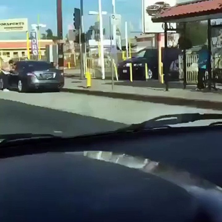 Woman Caught Hanging Onto Car During Road Rage Fight