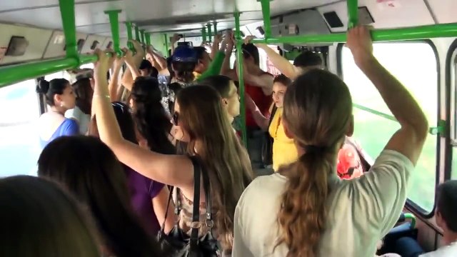 A Russian flashmob sings a Russian national song in a bus