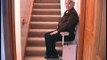 Gliding up the stairs in a stair lift.