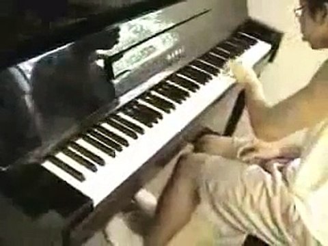Koji Kondo playing mario bros on a paino