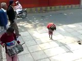 children beggars dancing in Delhi India for money