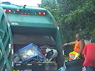 Ashley's old toys going in the garbage truck