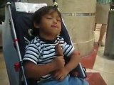 Little boy falling asleep trying to eat ice cream