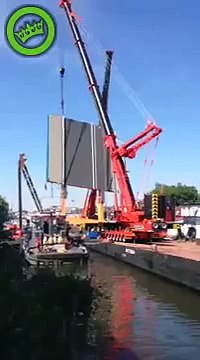 Woman cries while Crane falling from construction barge in Netherlands - Alphen aan de Rijn