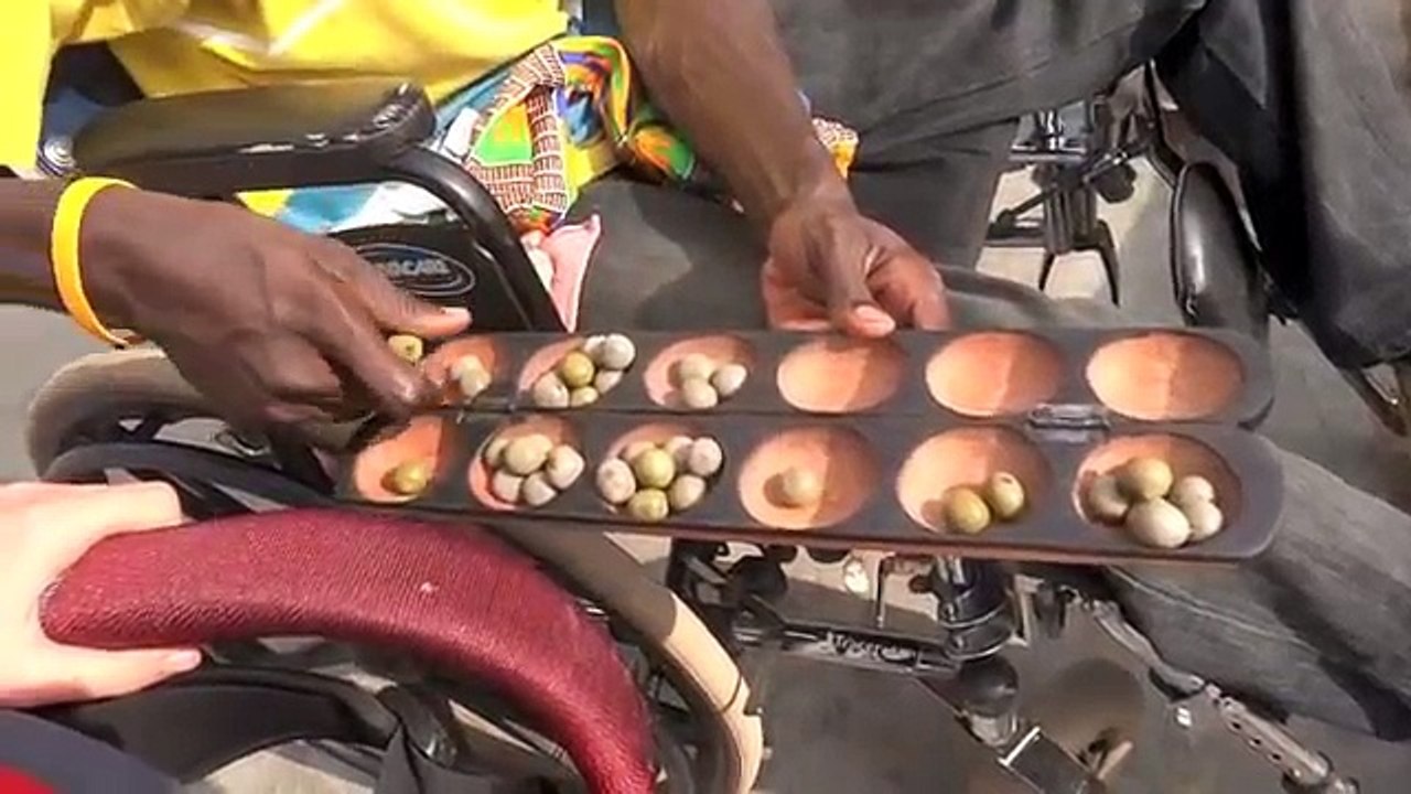Michael Explains Oware, a Traditional African Game Made by Persons with Physical Disabilities