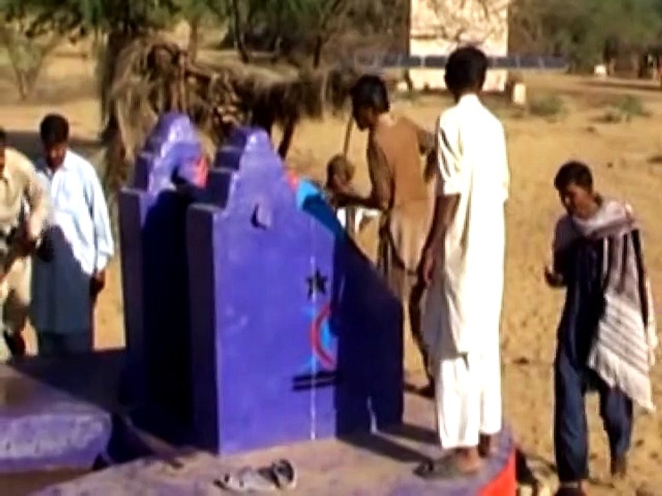 The Woman of Thar in their Traditional attire are drawing water from a new well dug by Customs Health Care Society.