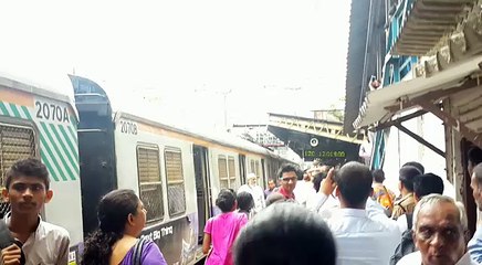 men burning live on charni road train station