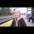 cute little girl saw live train first time in her life