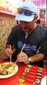 Dad eats Taiwanese stinky tofu. 美國爸爸來薹灣吃臭豆腐在士林夜市。