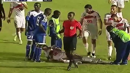 Medics drop an Al-Hilal player off a stretcher v Moghreb 2015