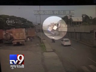 CCTV: Tyre burst causes truck to fall off bridge - Tv9 Gujarati
