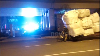 Dangerously overloaded delivery bikes in Shanghai