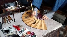 Artist in China paints using only his feet.