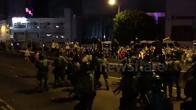 Riot police clash with protestors in Hong Kong