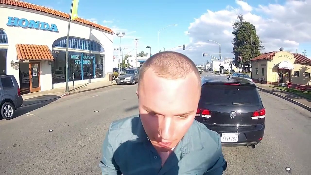 Crazy Guy hits motorcyclist Road Rage