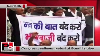 Suspension of MPs: Congress continues its protest at Gandhi statue in Parliament