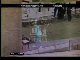 Children on a roundabout, 1980's.  Archive film 93665