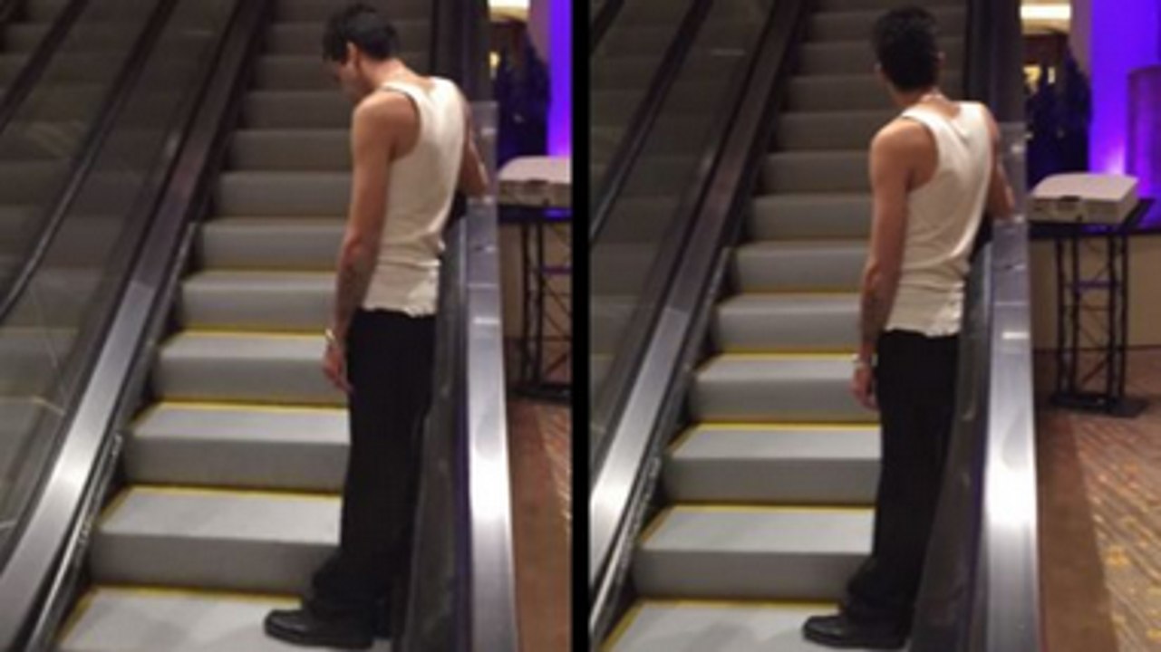 Drunk Guy Rides The World's Longest Escalator