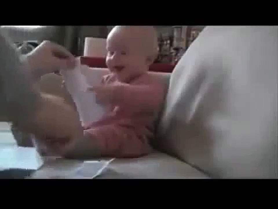 funny baby LAUGHING at ripping papers
