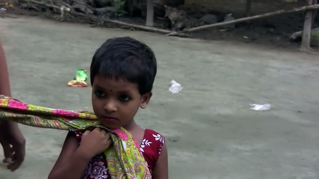 Little girl chases another girl for her Goat in Bangladesh Village