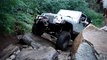 Jeep Rubicon Crawling Over Large Rocks