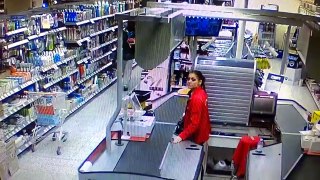 Thief casually steals from a Finnish store.
