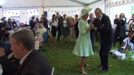 Camilla dances with Navy veteran at VJ Day celebrations