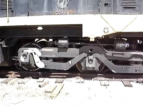 Train locomotive is re-railed after derailing.
