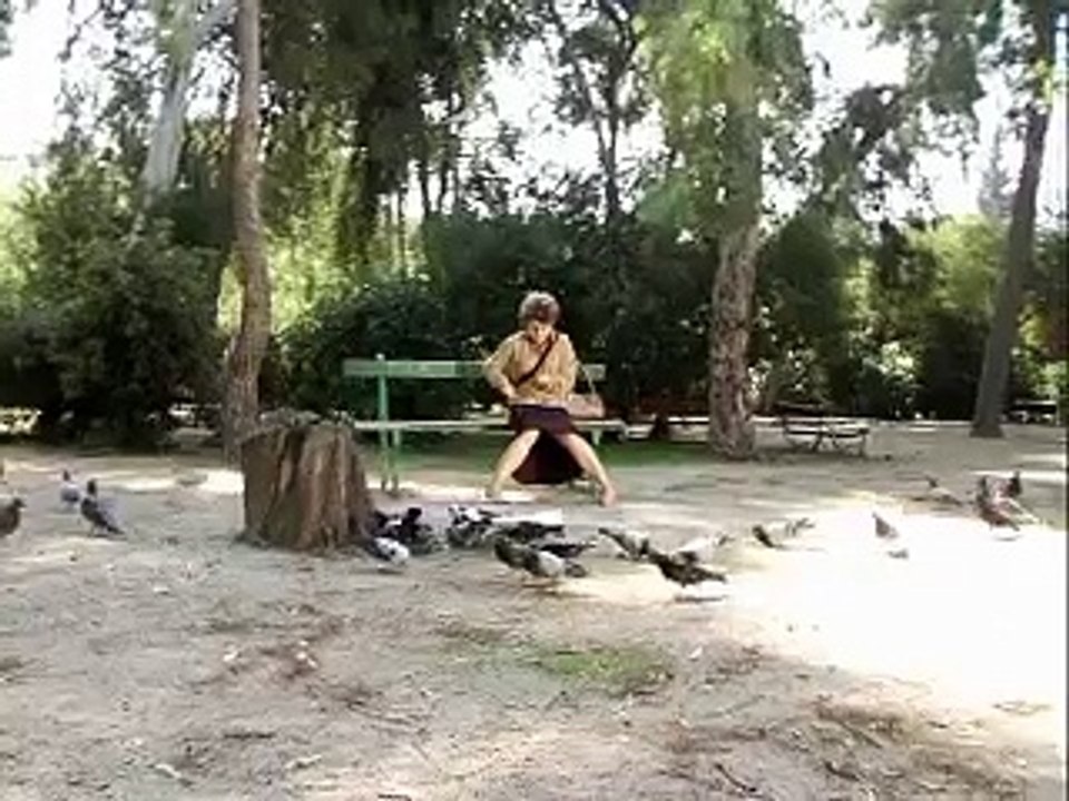 Crazy greek lady with machine gun shooting pigeons