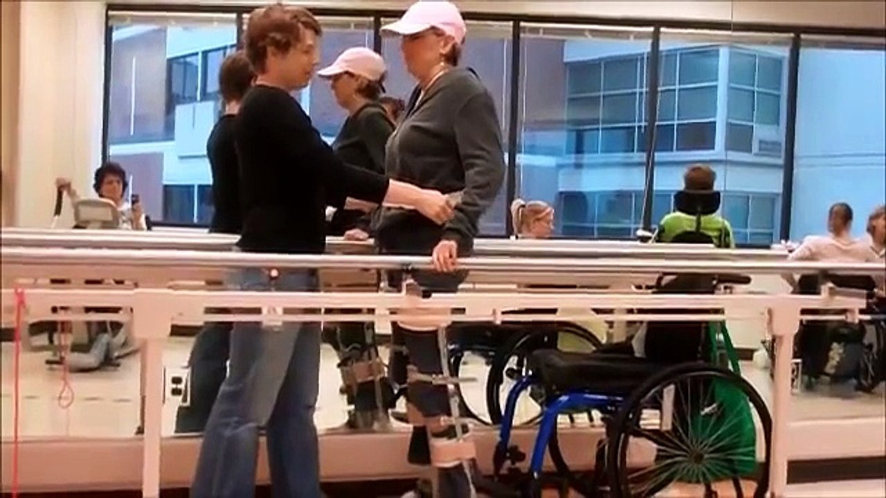 Maria walking on leg braces