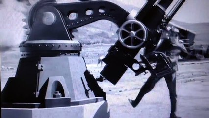 Charlie Chaplin with an artillery gun {The Great Dictator}