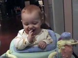 Giggling Baby Laughs at Paper
