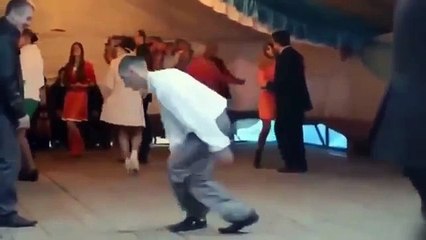 Very drunk guy dancing at a wedding
