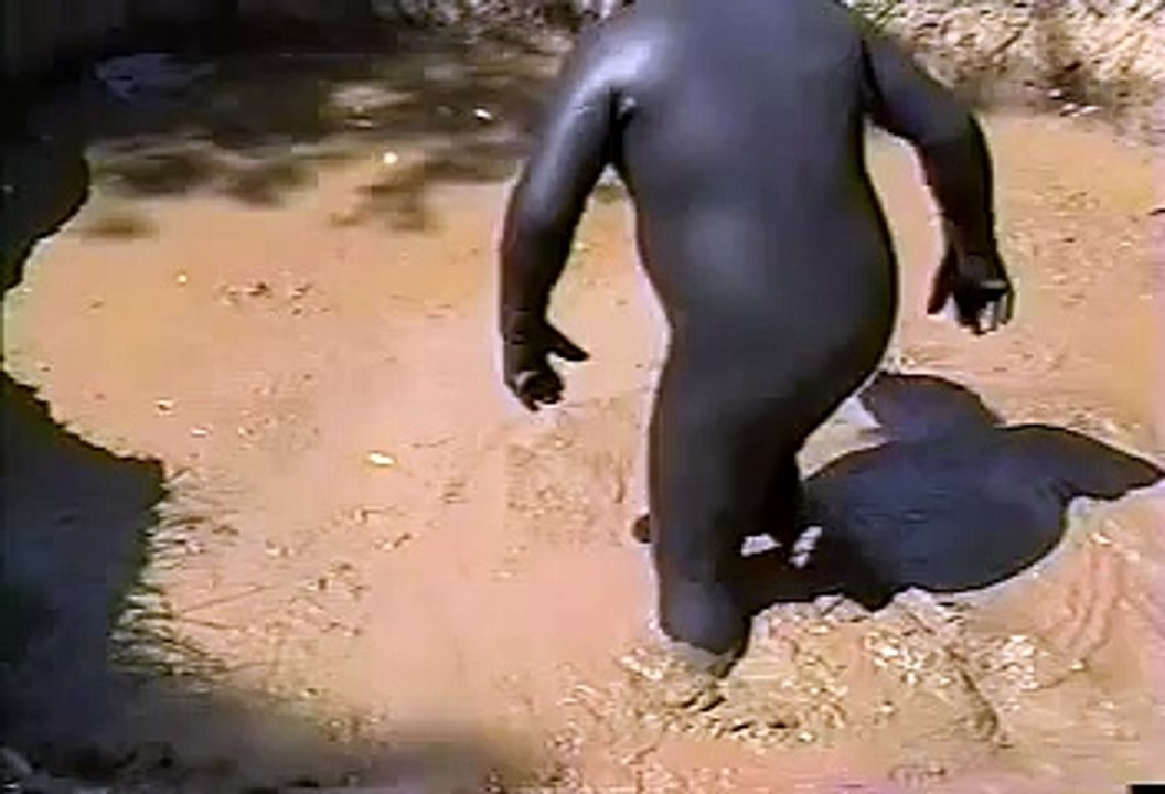 Rubber wetsuit in mud pit