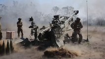 US Marines and Canadian Soldiers Firing Together the Powerful M777 Howitzer