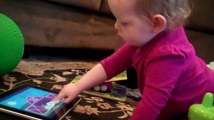 Annie plays Peekaboo Barn on the iPad