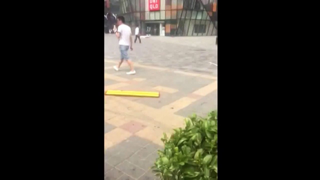 Beijing Uniqlo sword 'attacker' wanders calmly outside store