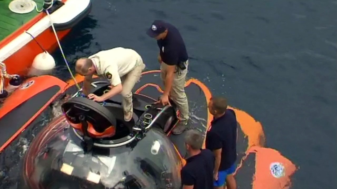 Vladimir Putin takes a dive in an underwater submersible